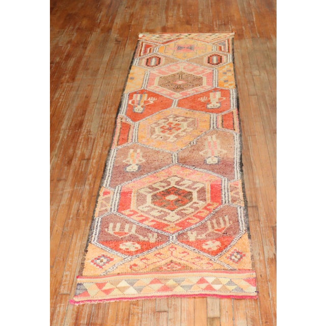 Mid 20th century Tribal Turkish Geometric runner featuring 2 men and 2 women on a geometric colorful motif Measures:...