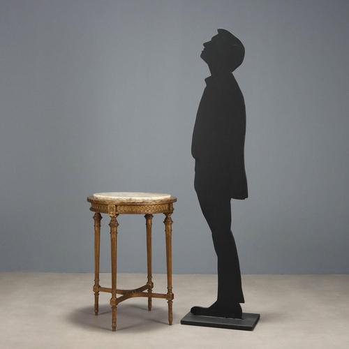 Neoclassical-style coffee table. Round marble top supported by four turned, truncated-conical legs joined to the base by a...