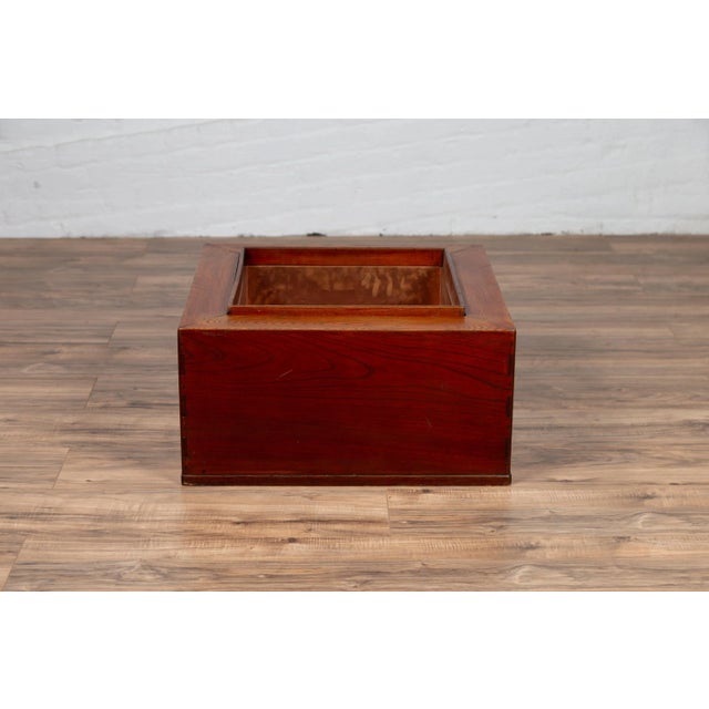 A Japanese rectangular keyaki wood hibachi from the 19th century, with copper liner. Used for cooking or warming sake or...