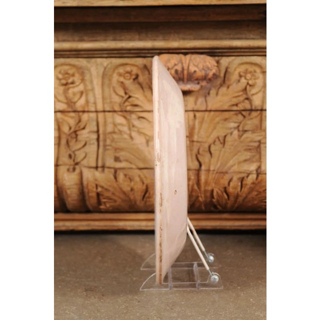 A Italian pottery platter from the early 20th century with blue deer motif and weathered patina. Created in Northern Italy...