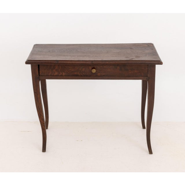 French Provincial Oak Side Table, with single drawer and brass hardware on four cabriole legs. 24" H x 32" W x 19" D....