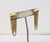 1970s oval ribbed goldtone top with goldtone looped fringe pierced push back earrings. Marked "MONET" around the base of...