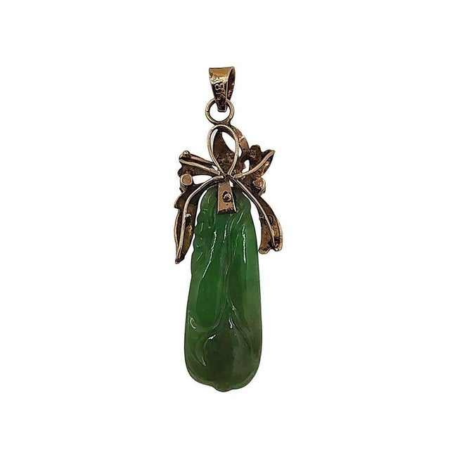 Antique Art Nouveau 18K Carved Jade Pendant, Circa 1910. This antique pendant is crafted in 18 karat yellow gold featuring...