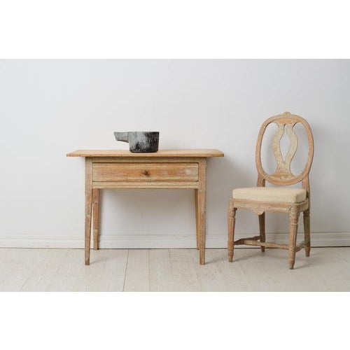 Charming Swedish country table from the gustavian period around 1810 to 1820. Made in solid pine in northern Sweden with...