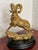 Cast solid brass ram statue, shown surveying from a rocky outcrop. The cast detail is rich, with deep textured fur and...