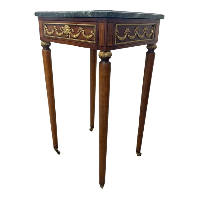 1970s Vintage Green Marble Top Stand on Wheels With Gold Colored Motif of Woman. For Sale