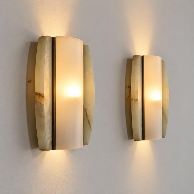 Pair of Italian wall lights from the late 1960s, combining natural onyx with softly diffused opaline glass. Each sconce...