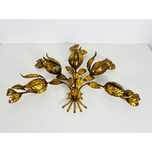 An extraordinary wall lamp by Hans Kögl made in Germany in the 1950s. The lamp has a beautiful flower design. It is made...