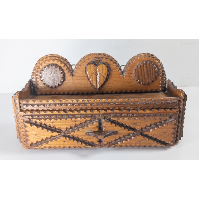 We are selling this simple early 20th century Folk Tramp art piece. This single drawer piece is made to hang on a wall,...