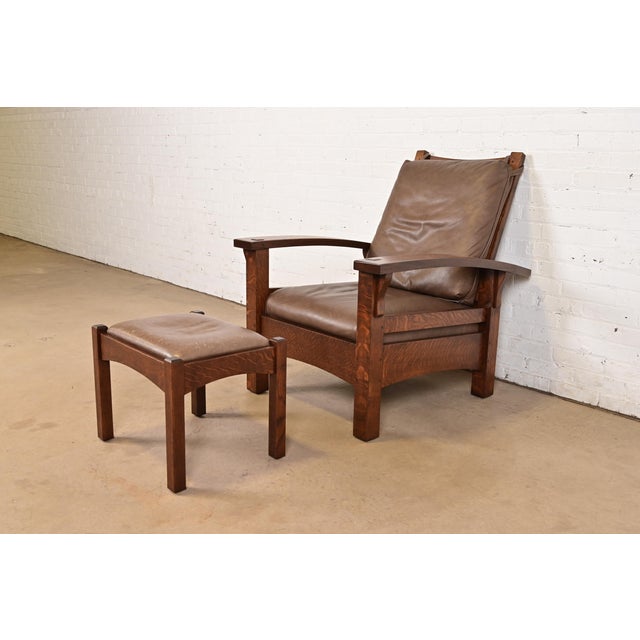 An exceptional Mission or Arts & Crafts bow arm reclining Morris lounge chair with ottoman Designed by Gustav Stickley...