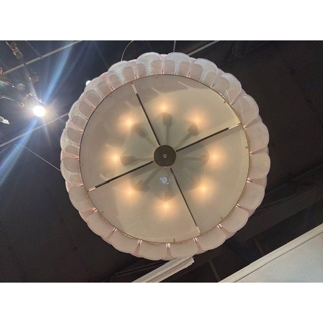 The Bespoke Modern Murano Glass Drum Chandelier in Pink and White is a stunning glistening fixture. The chandelier is...