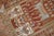A fine rust colored Caucasian rug depicting a large light blue colored horse and 4 roosters dated 1948. Measures: 4'3" x...