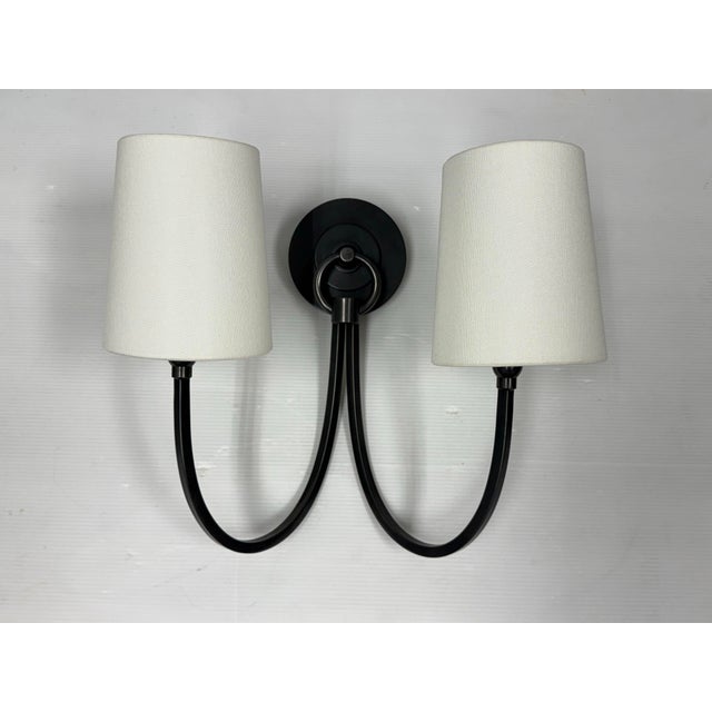 Design Plus Gallery presents a Reed Double Sconce by Tomas O'Brien for Visual Comfort & Co. This two-light wall fixture...