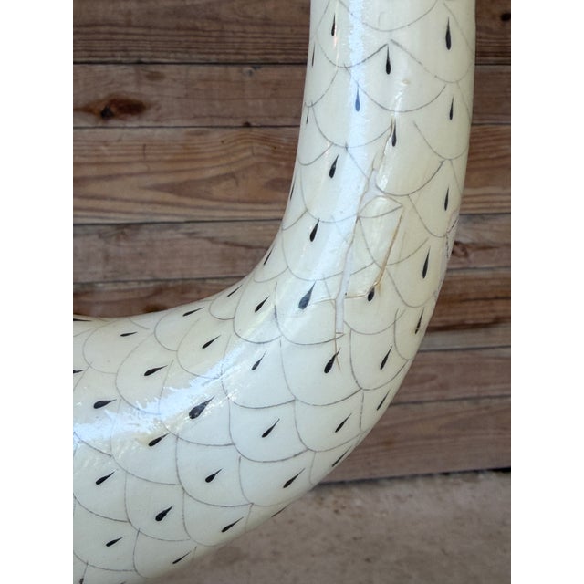 Striking vintage flamingo sculpture featuring a hand-painted body with detailed feather work and long, slender metal legs....