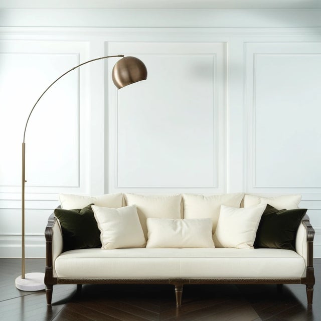 Add elegance and a touch of drama to your living room with this Mid-Century Modern style floor lamp. Slender, arching,...