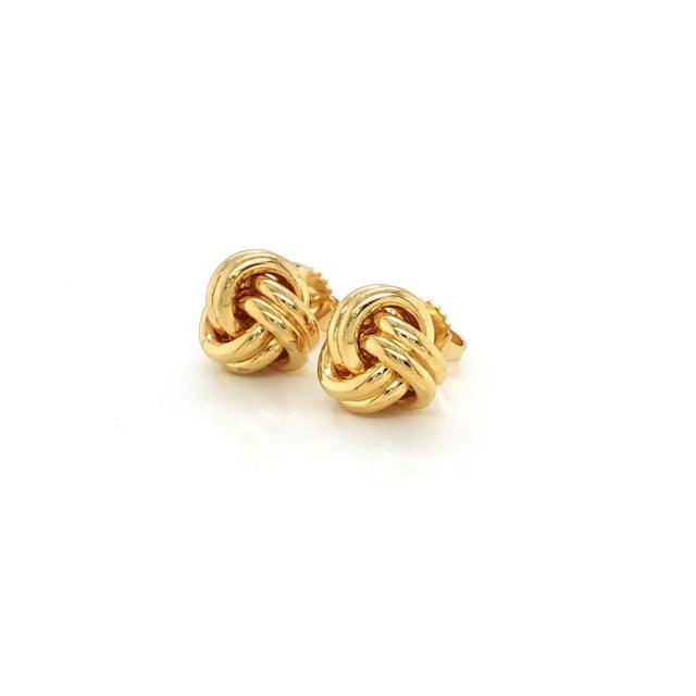 This authentic Tiffany & Co. pair of Love Knot stud earrings is crafted in solid 18k yellow gold with a brilliant high-...