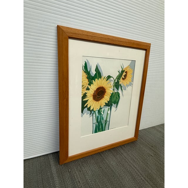 Design Plus Gallery presents Sunflowers in a Crystal Vase by Sally Baker. The upright flowers are in full blossom with...