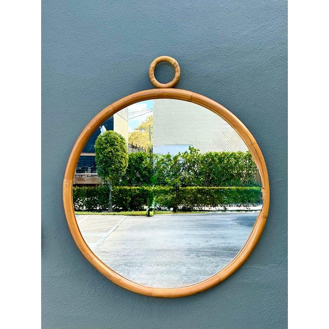 Elevate your entryway or living space with this exceptional vintage round wall mirror, a standout example of 1970s organic...