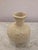 Circular base ceramic vase with narrow opening