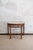 Pair of Faux Bamboo Demi-Lune Consoles – 1970s Turned wood structure with a faux bamboo finish, featuring a glass top and...