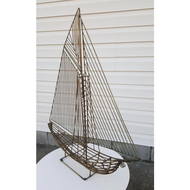 Intricate wire rod freestanding metal sculpture by Curtis Jere and signed C. Jere 1981. This sculpture is brass...