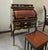 Bring timeless European sophistication to your home or office with this exquisite French roll top secretary desk. Crafted...