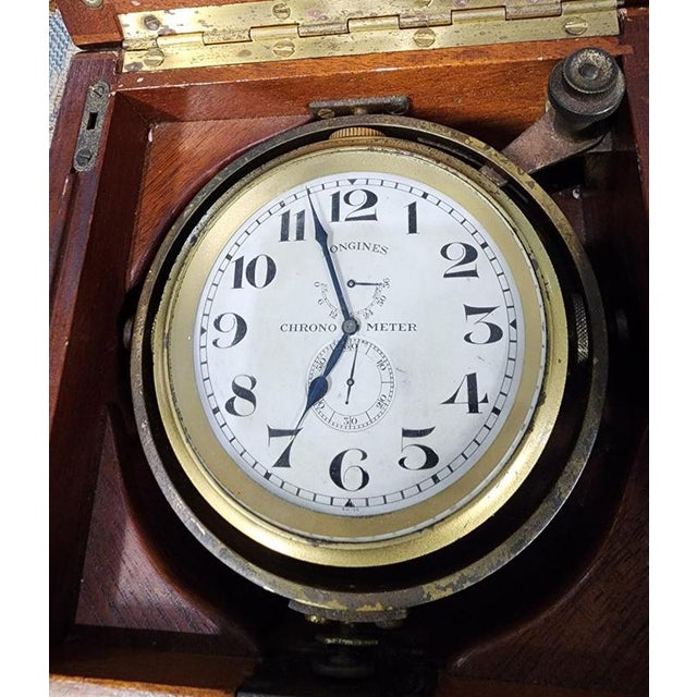 A handsome early–mid 20th-century Longines marine chronometer, housed in its original mahogany single-tier chronometer box...