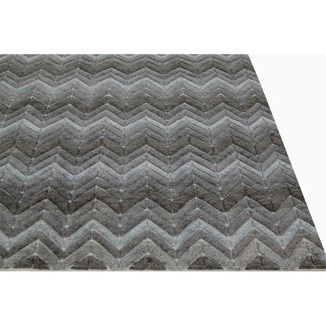 Modern Handwoven Moroccan Area Rug featuring an all-Over design in a blue and Gray colored field. Created from 100%...