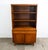 Mid Century Modern walnut display hutch / China cabinet in a unique design. This piece offers many unique features include...