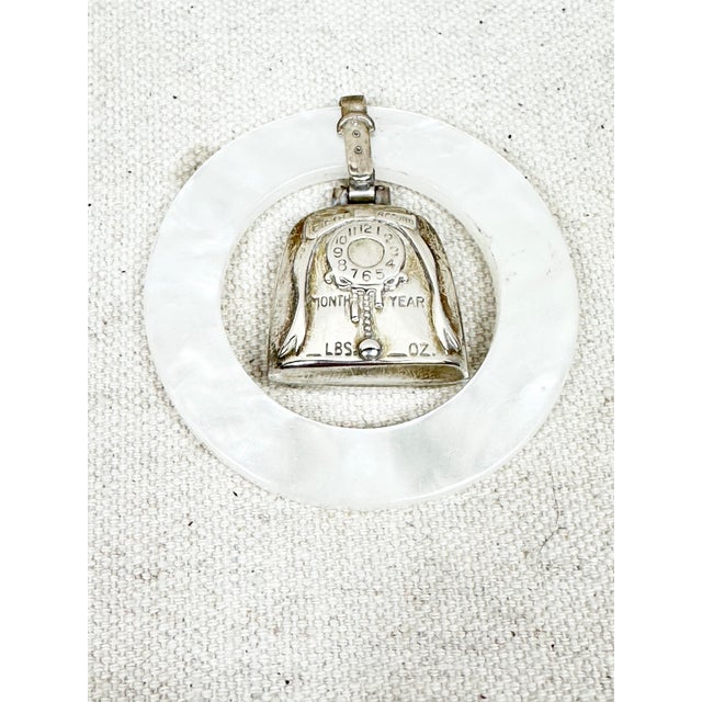 Adorable vintage rattle/teething ring. Never used. Made of sterling silver and acrylic. Never used. You can have it...