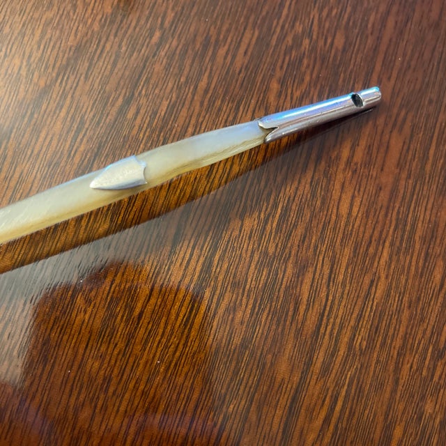 Rare English Edwardian Carved Spoon with sterling silver mounts, an un-engraved shield and a whistle tip.