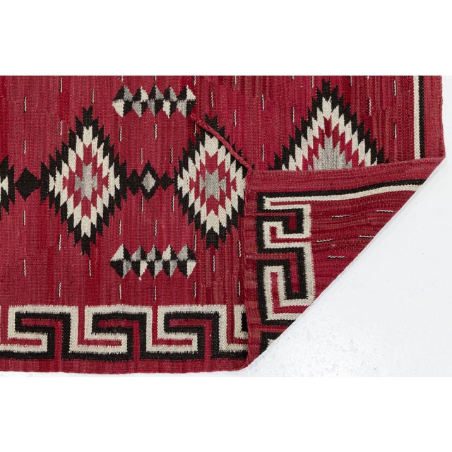 Elevate high-end interiors with this striking Modern Navajo Style handmade wool runner rug. Defined by a rich, crimson...