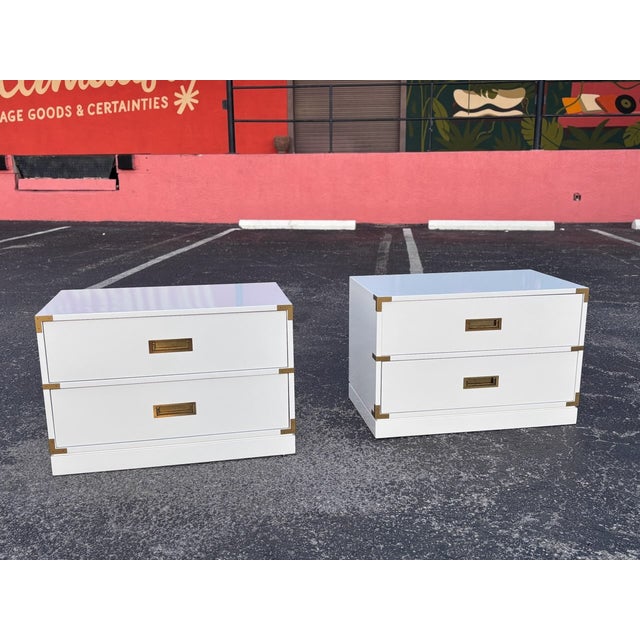 Terrific pair of classic campaign nightstands or end tables. Freshened in a high gloss white that has a great shine to it....