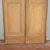 This imposing antique double door, dating back to the late 18th century, is an excellent example of rustic solid wood...