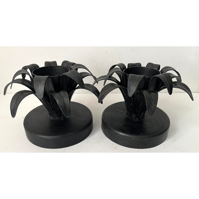 This wonderful pair of handmade Black wrought iron candle holders have a Modern look and feel .Holds votives or pillar...