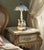 This mid‑century Von Schierholz porcelain table lamp is a richly detailed sculptural piece featuring four children holding...