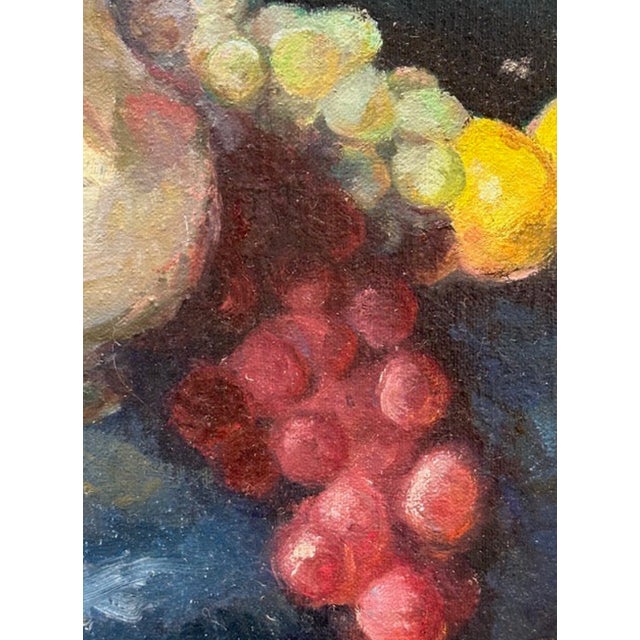 Fabulous vibrant still life oil painting on canvas, depicting a traditional old world table-scape with grapes, lemons, and...