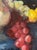 Fabulous vibrant still life oil painting on canvas, depicting a traditional old world table-scape with grapes, lemons, and...