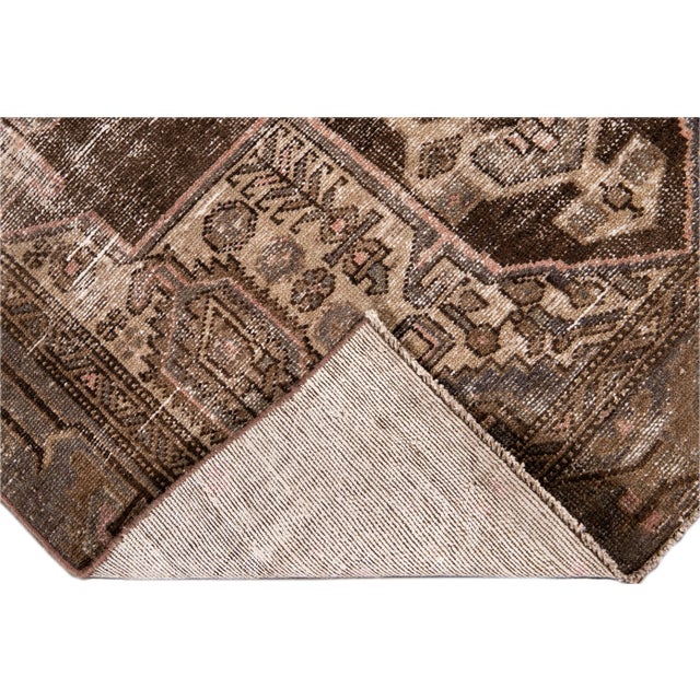 Beautiful Vintage Persian Distressed hand-knotted Wool Rug with a Brown field. This piece has multicolor accents in all-...
