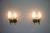 This exquisite pair of wall lamps from 1960s italy embodies the elegance and craftsmanship of mid-century modern design....
