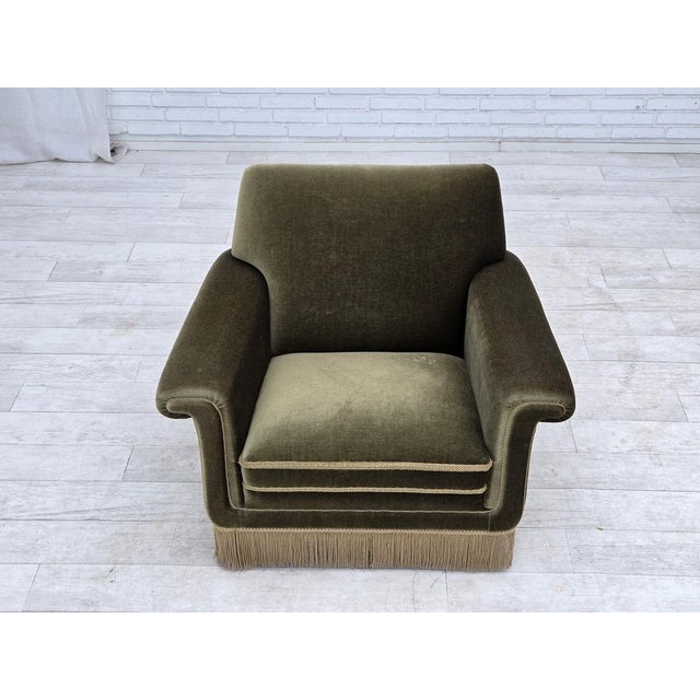 1970s, Danish armchair. Original green furniture velour, beech wood legs, springs in the seat. Original very good...