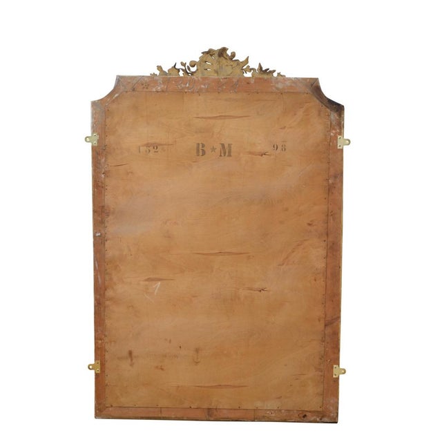 Very attractive gilded mirror, having original bevelled edge glass with some foxing in beautifully carved frame with...