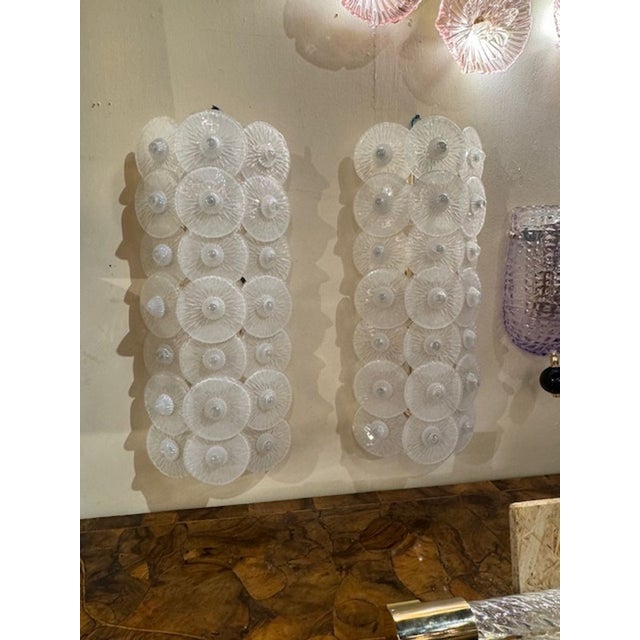 Nice large scale pair of Murano glass sconces with multiple white discs. Creates a very textural look. So pretty!! Two...