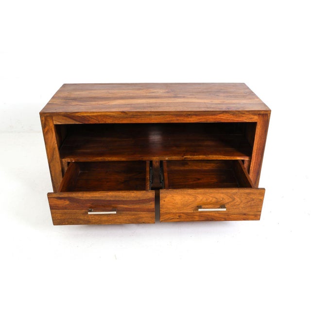 This is a rosewood chest with drawers or it could be used as a console/media stand. It is marked with Kolonialmoebel and...