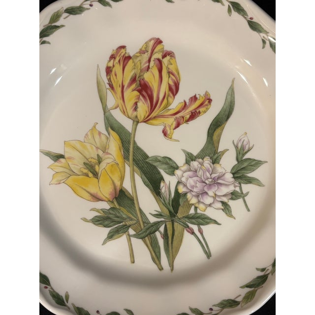 This elegant yet sturdy dinner plate from Noritake’s Gourmet Garden collection features a yellow and red tulip and other...