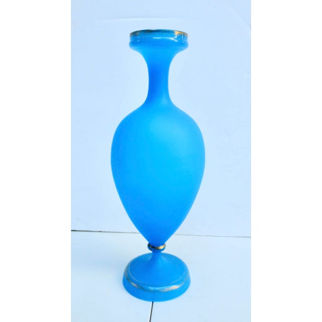 French Blue opaline vase. Satin finish with gilt rings around the rim and foot. Vivid blue translucent glass with a stem...
