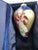 This is a large glass ornament. It is reverse painted, featuring a beautiful angel with golden wings.. The box is included.