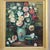 A vintage oil on canvas painting, circa 1960, depicting a vibrant floral still life. This unsigned work captures a lush...