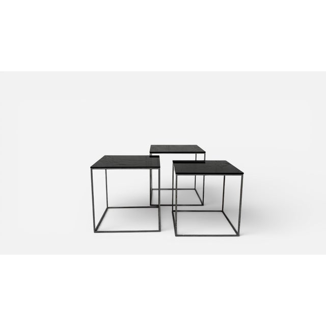 Toy-like in scale and weight, this set of nesting tables can be used functionally or objet d'art. No label present.