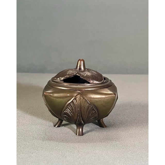 A beautiful square footed incense holder decorated with leaves made by Kronheim & Oldenbusch.